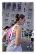 Women Running Past Building